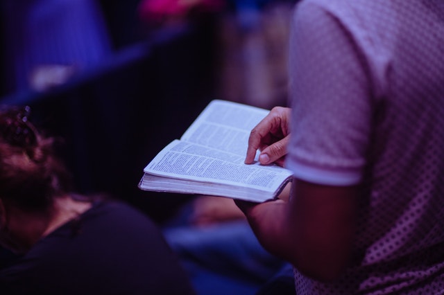 selective-focus-photo-of-person-holding-book-2351719